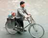 Locksmith. Note the keys in the back of his bike (32,575 bytes)